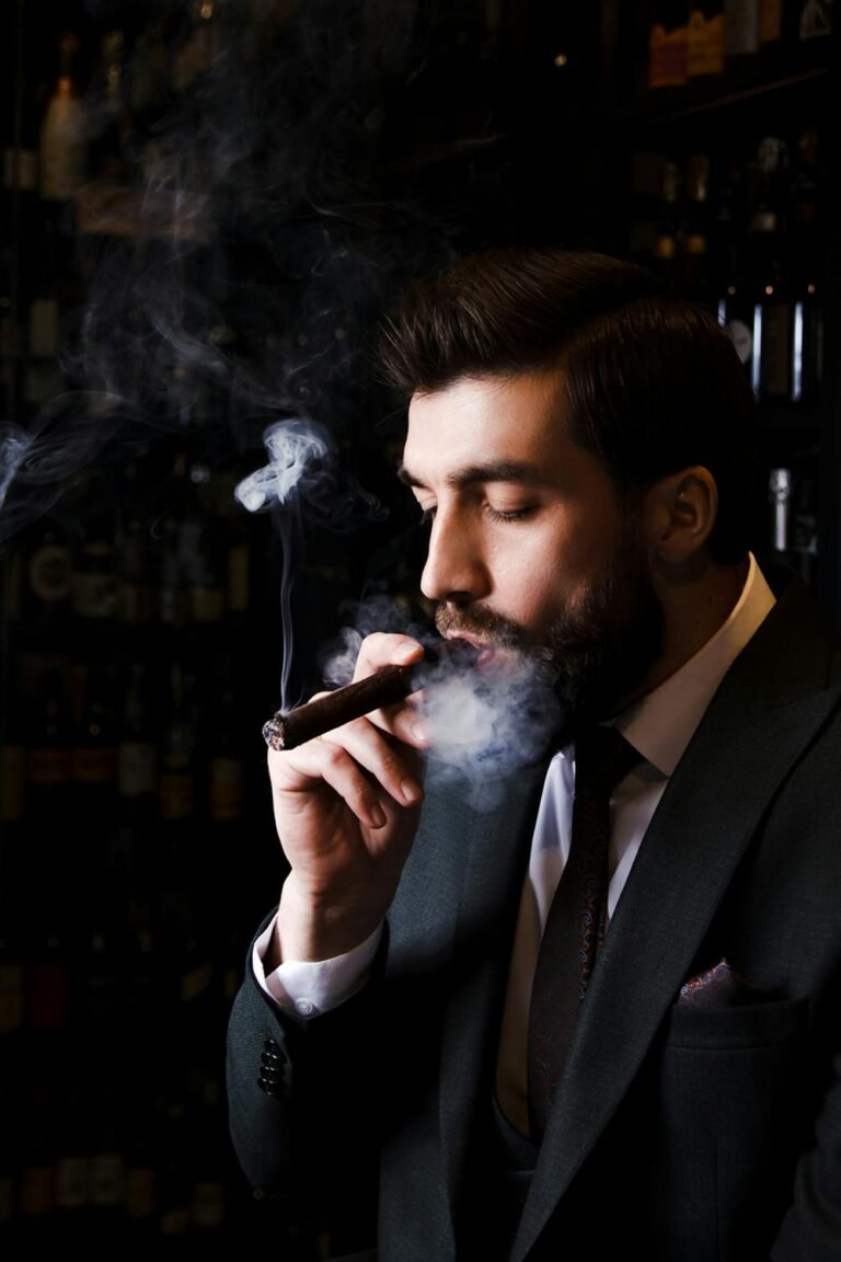 best cigar holders for golf carts - elegant man smoking cigar luxury lifestyle